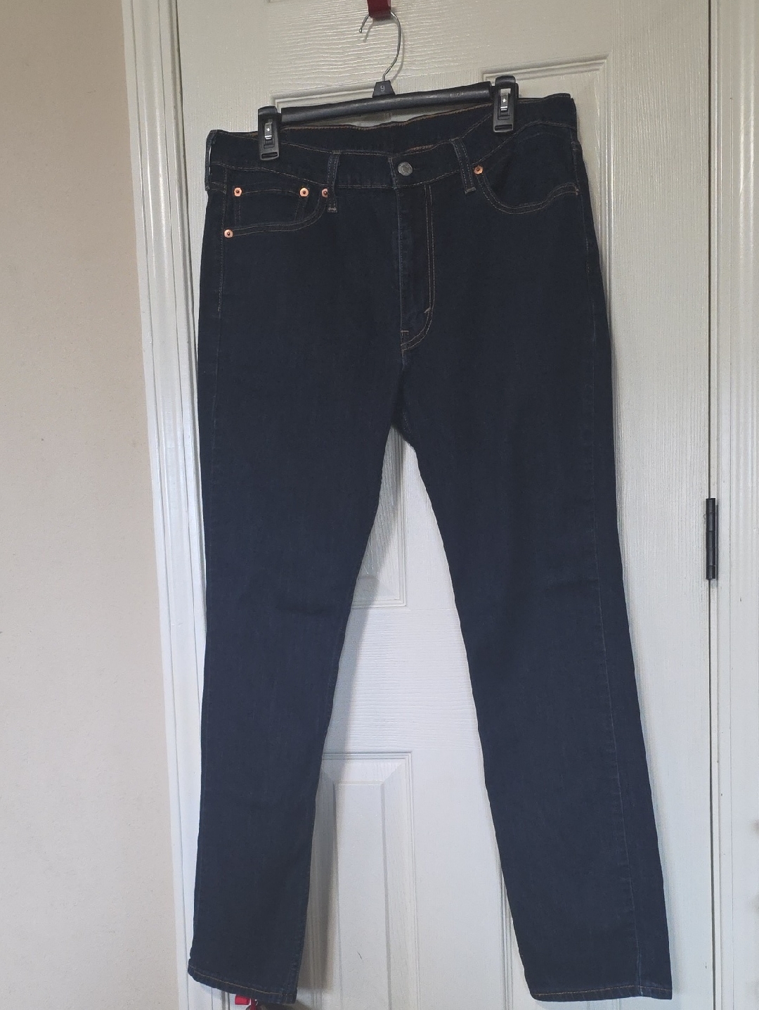 Levi's Navy Blue Jeans With Tan Patch And Red Logo
